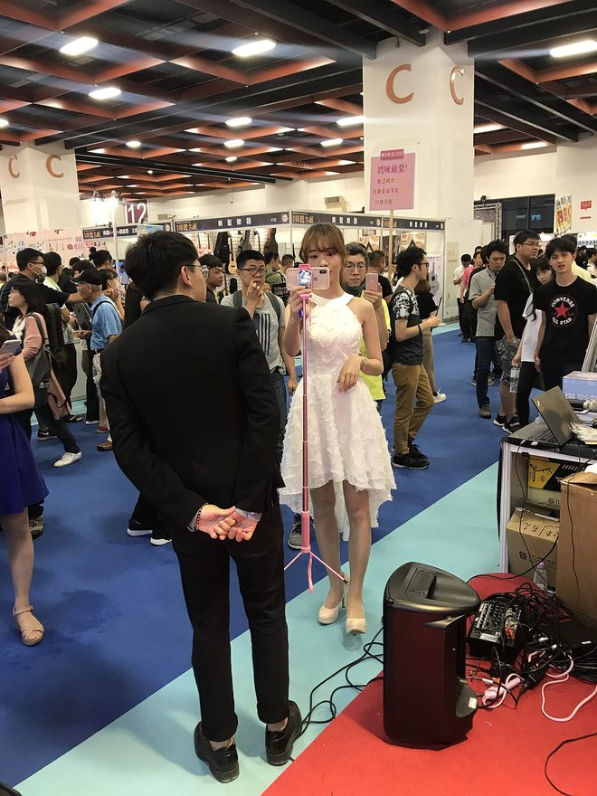 A person taking a selfie with a smartphone